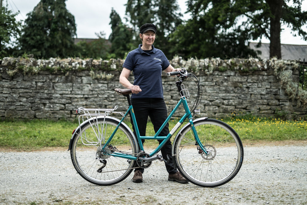 Lydia has long legs and likes to put as little strain on her neck as possible. She also wants to continue cycling for as long and as comfortably as possible. Her Beaumont features an automatic  B&amp;M  lighting system that responds to the time of day. The bottle cage is very accessible and not attached to the frame because the rider needs the step-through area to be fully clear to get on and off. Disc brakes (mechanical), swept back bars and ergo grips give her a very comfortable hand, arm and shoulder position. Gearing is 2x10. Outer ring 40 and inner 28. Cassette 11-36. I'm all in favour of 1x11 systems, but at 72 Lydia has a style of pedalling that suits her and I have just made it even easier.
